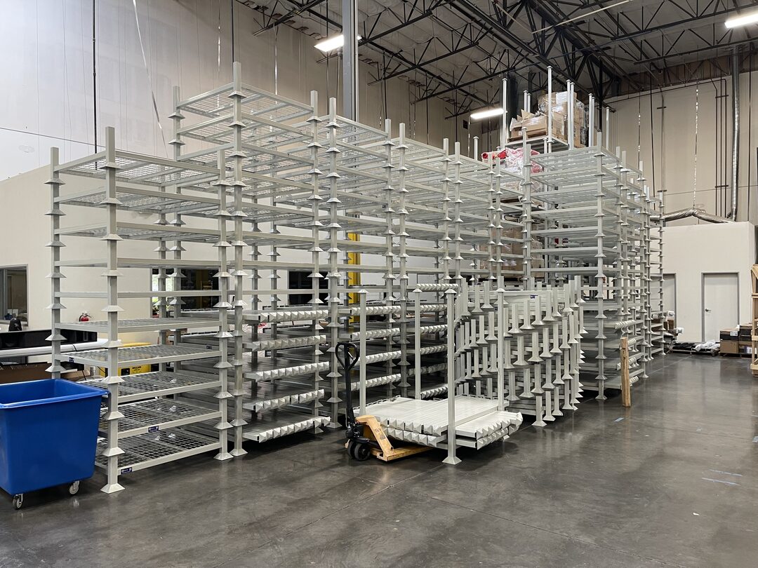 White portable stack racks staged together for evaluation